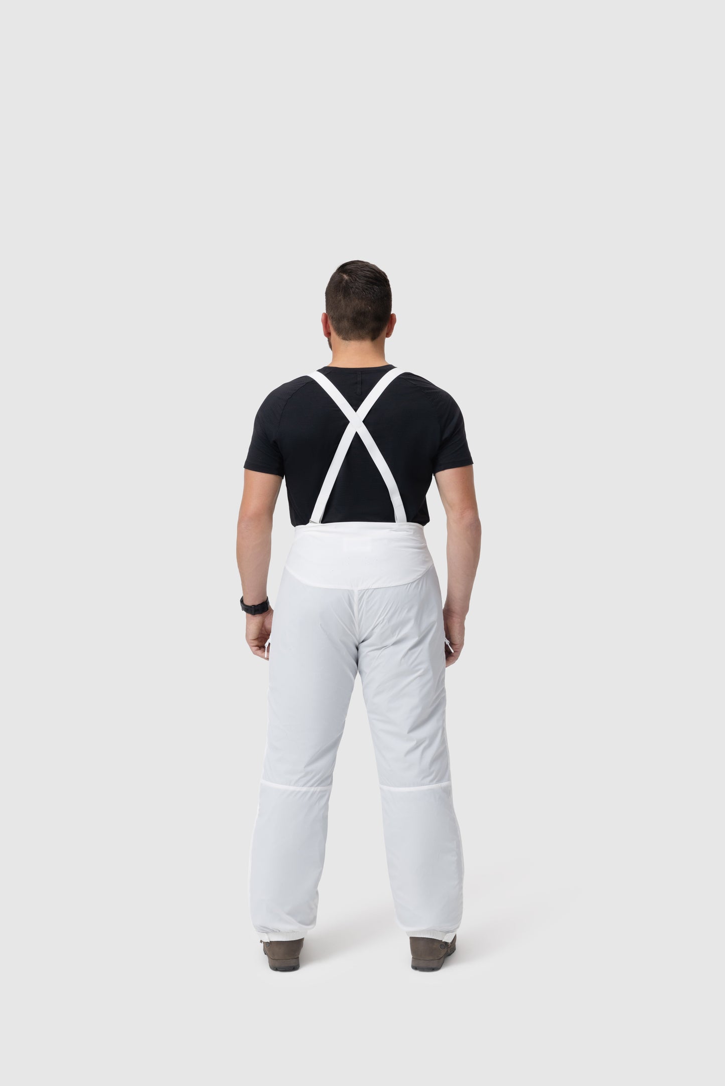 Back photo of the Tomahawk Performance Overlayer Pants, tactical alpine overwhites, in the Overwhite color way, showing suspenders.