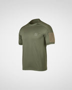 An olive green short-sleeve tactical t-shirt with a tan mesh patch on the right sleeve and a small square logo patch on the left chest, shown on a light gray background.