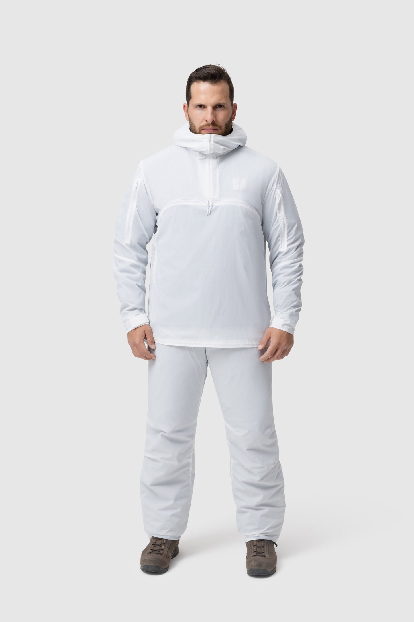 Frontal photo of the Tomahawk Performance Overlayer Anorak and Overlayer Pants, a tactical alpine overwhites set, in the Overwhite color way.