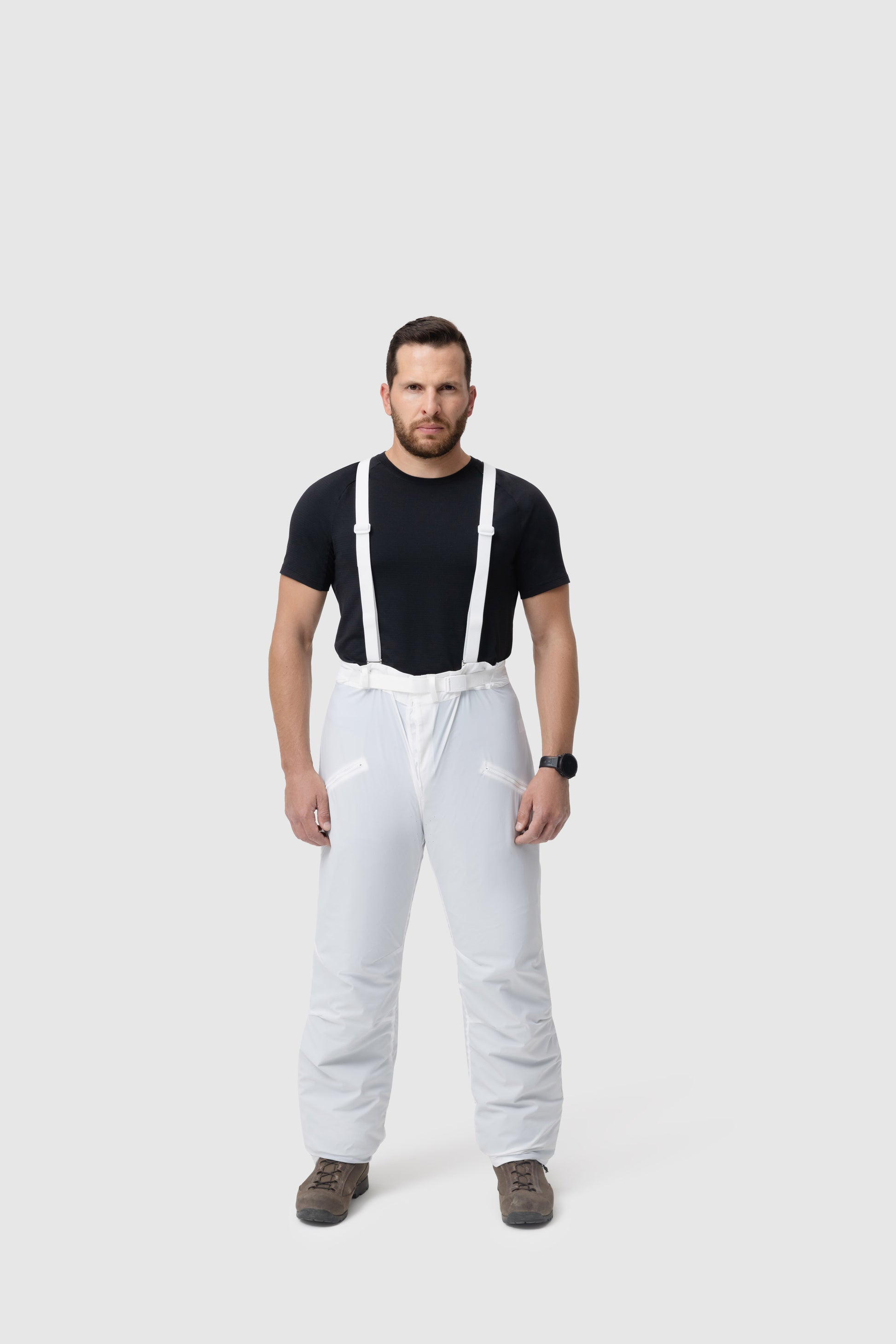 Frontal photo of the Tomahawk Performance Overlayer Pants, tactical alpine overwhites, in the Overwhite color way, showing suspenders.
