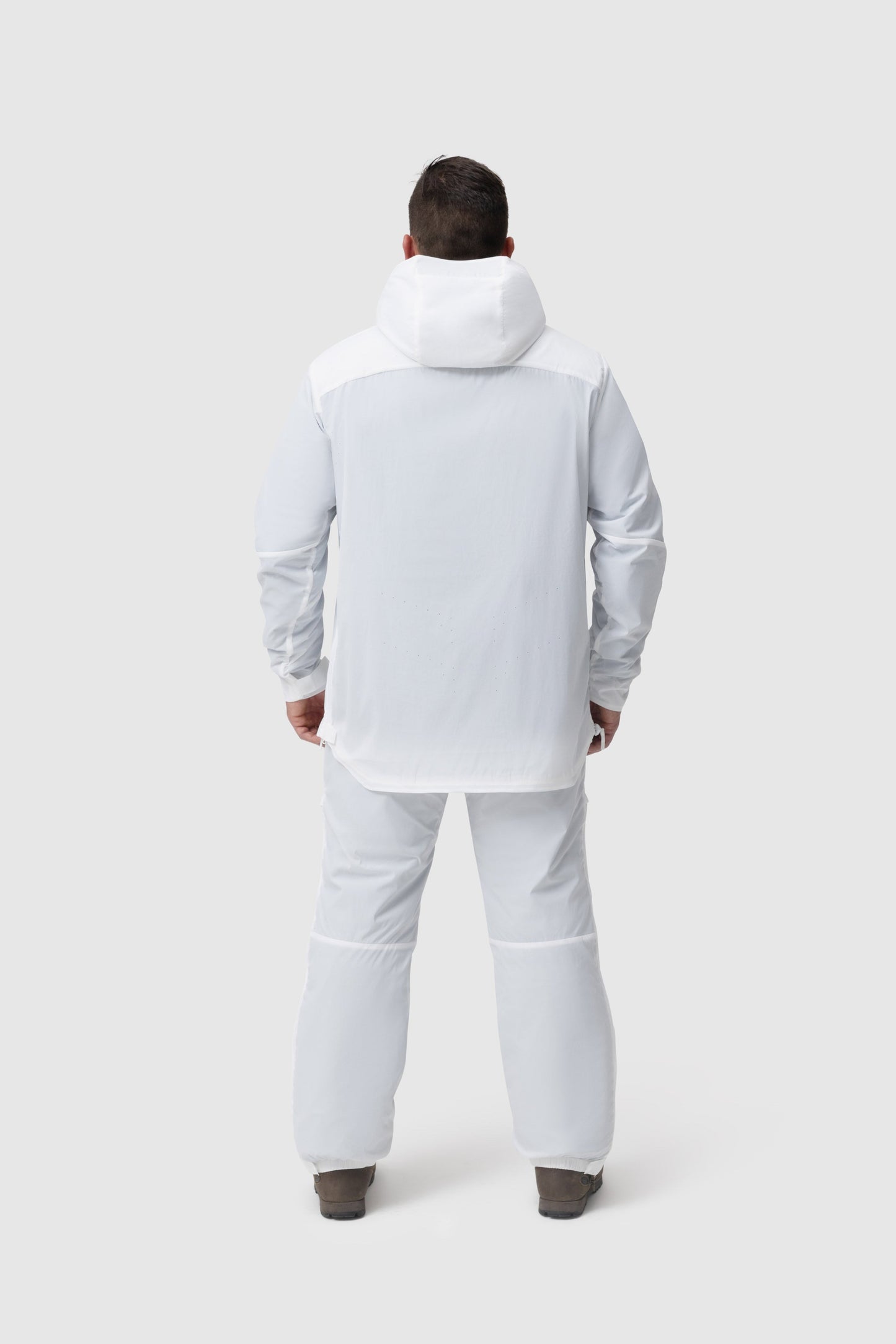 Back photo of the Tomahawk Performance Overlayer Anorak and Overlayer Pants, a tactical alpine overwhites set, in the Overwhite color way.