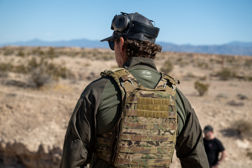 Back photo of a man wearing the Tomahawk Performance HW / Combat Shirt in the desert. 