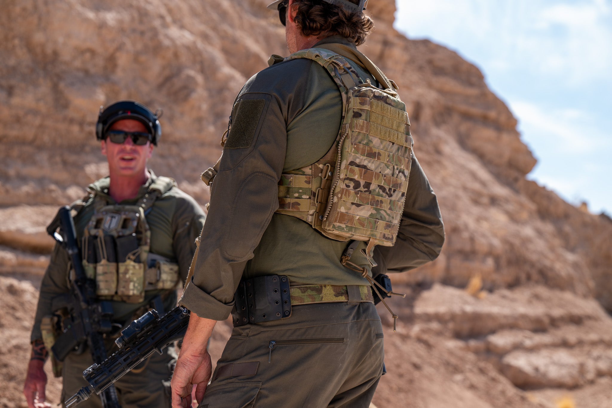 Two men wearing the Tomahawk Performance HW / Combat Uniform in a desert canyon.