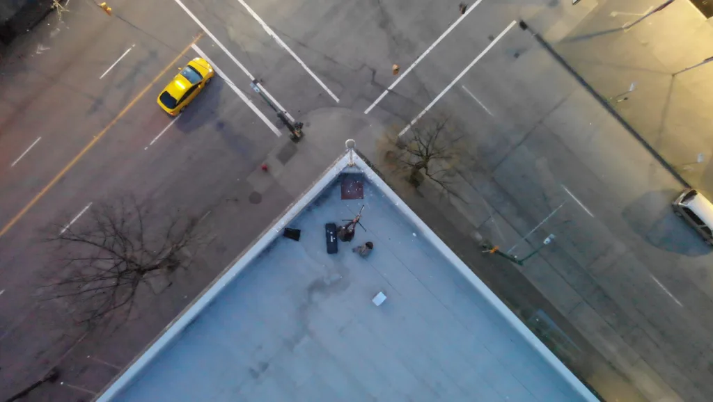Drone photography of a street corner at night.
